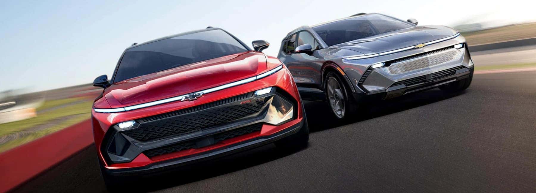 Red Chevrolet Equinox  EV RS and Silver Equinox EV Driving Next To Each Other | Chevrolet Dealership Near Mescalero, NM