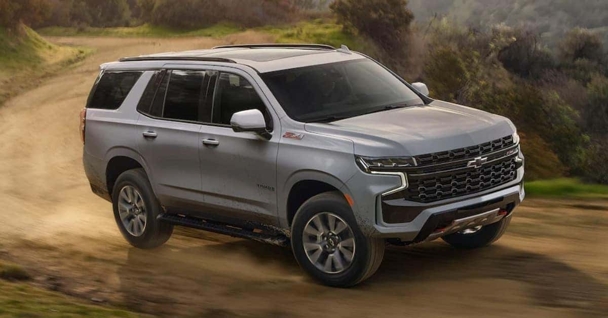 2023 Chevrolet Tahoe Driving Down Dirt Road In The Mountains