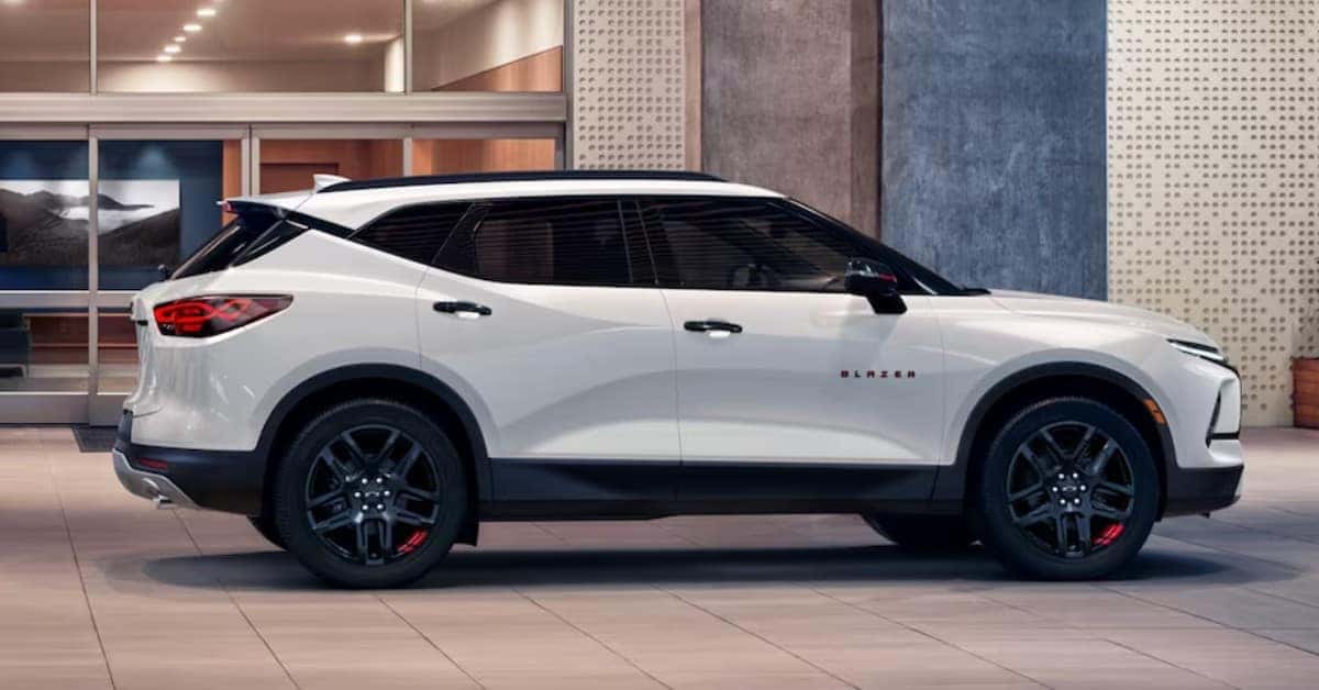 White 2023 Chevrolet Blazer Parked In Front Of A Building