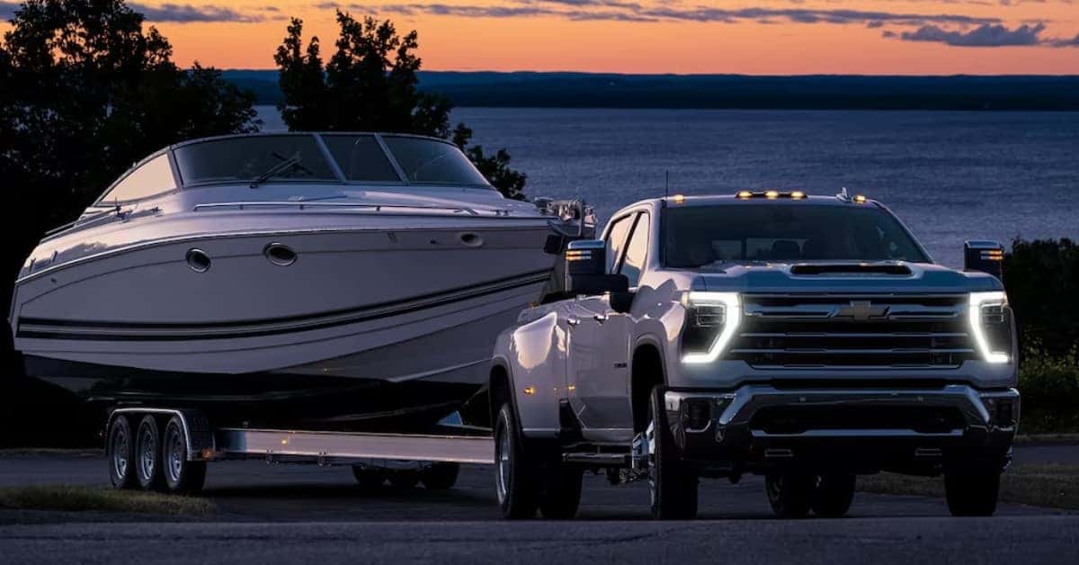 White 2023 Chevrolet Silverado 3500 Towing A Boat