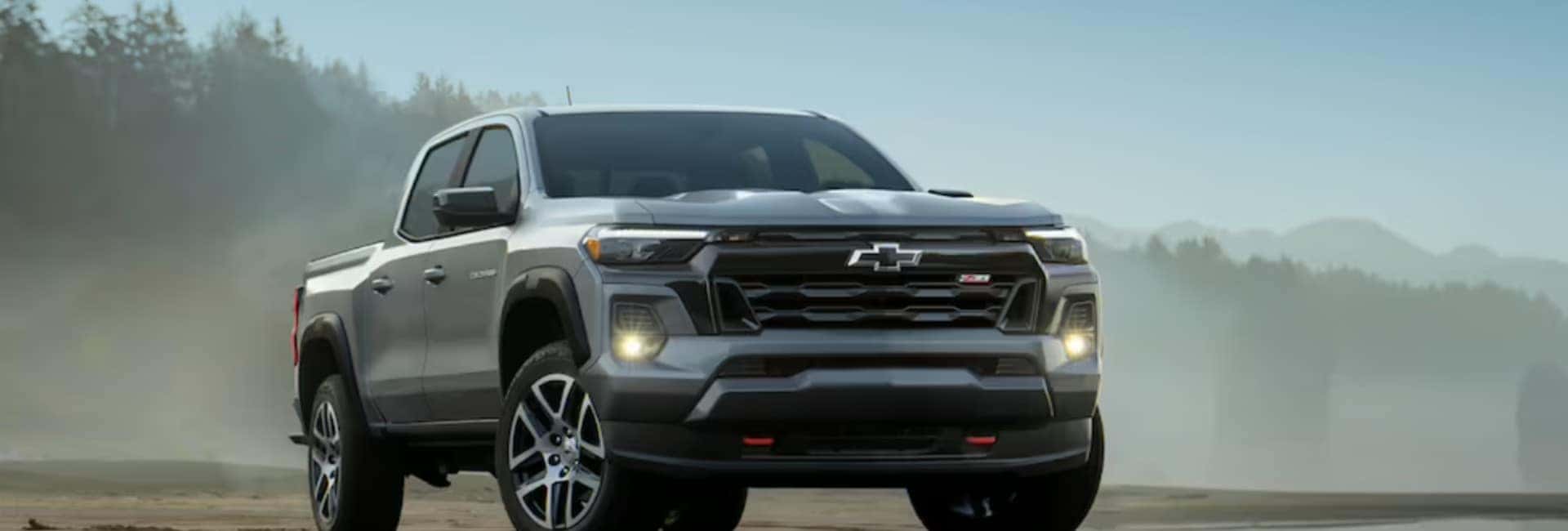 Gray 2023 Chevrolet Colorado Parked With Trees In The Background | 2023 Chevrolet Colorado For Sale | Sierra Blanca Motors