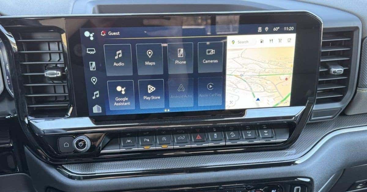 The interior dashboard of a Chevrolet Silverado 1500, featuring a large infotainment screen with app icons like Android Auto and Apple CarPlay, surrounded by sleek air vents and tactile control buttons.