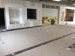 June 14, 2016 - Tiling of the new service drive has begun.