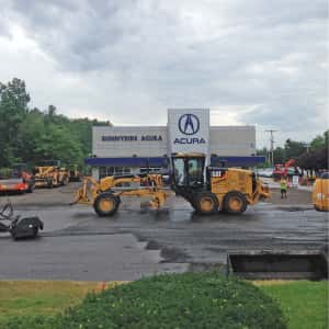 July 18, 2016 – The first stage of repaving - stripping the old asphalt. Sunnyside Acura Nashua, NH