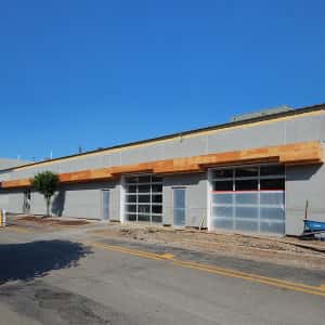 June 24, 2016 - The new service drive entrance with first layer of stucco complete.