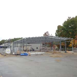 October 16, 2015 - The service department expansion has been framed out. The new "vehicle spa" drive-through can be seen on the left side.