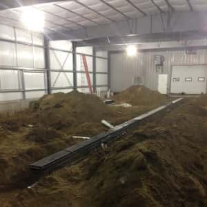 December 4, 2015 - The drain is being set down the middle of the new service department vehicle maintenance area.