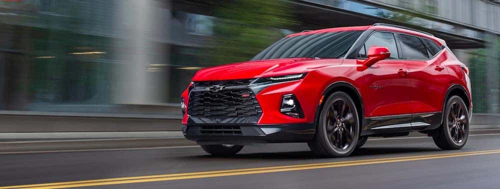 Red 2019 Chevrolet Blazer driving down a street