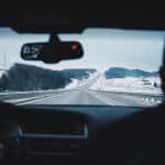 Passengers in Car Driving Vehicle During the Winter