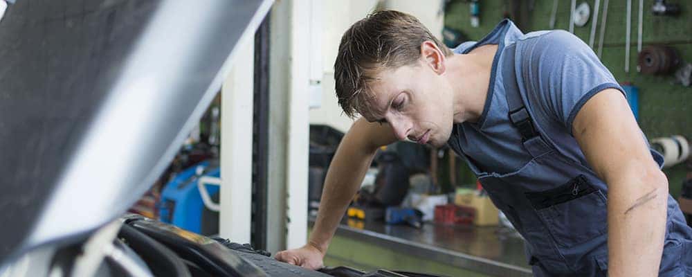 Mechanic checking car