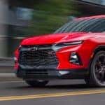 Red 2019 Chevrolet Blazer driving down a street