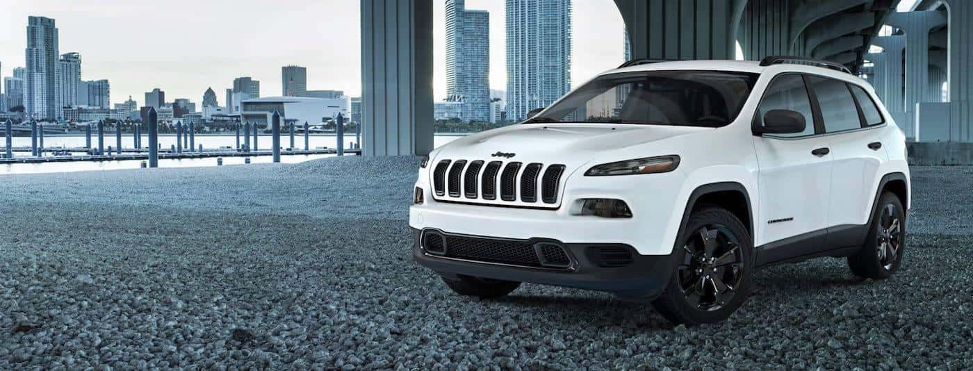 White 2017 Jeep Cherokee Limited Edition parked underneath overpass in city