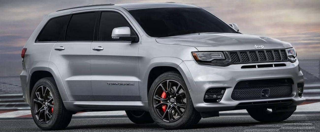 A silver 2017 Jeep Grand Cherokee SRT on a racetrack