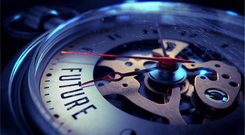 Close-up of the gears on a clock that has the word "future" on it