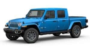 A Blue 2020 Jeep Gladiator is facing left with white background.