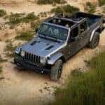A grey 2020 Jeep Gladiator is off roading in Colorado Springs, CO.