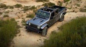 A grey 2020 Jeep Gladiator is off roading in Colorado Springs, CO.