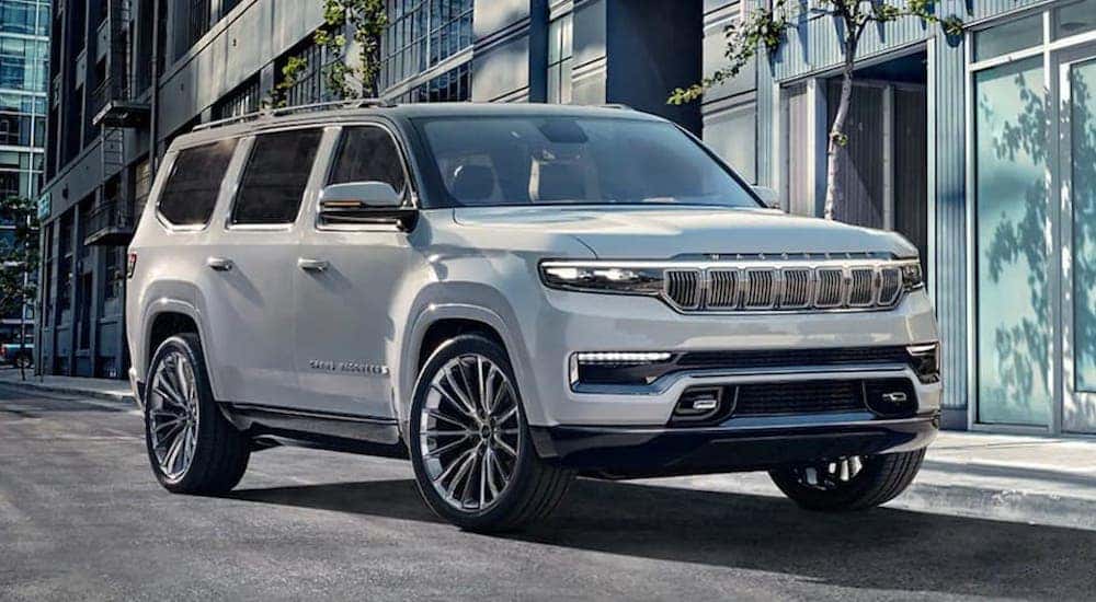 A white 2023 Wagoneer is shown from the front at an angle.
