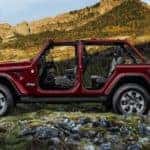 A burgundy 2021 Jeep Wrangler Unlimited is shown from the side with no doors or roof.