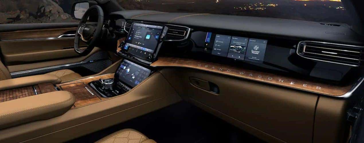The black and tan interior of a 2022 Grand Wagoneer is shown.