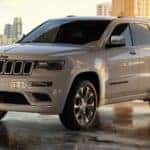 A white 2020 certified pre-owned Jeep Grand Cherokee is parked in a lot.