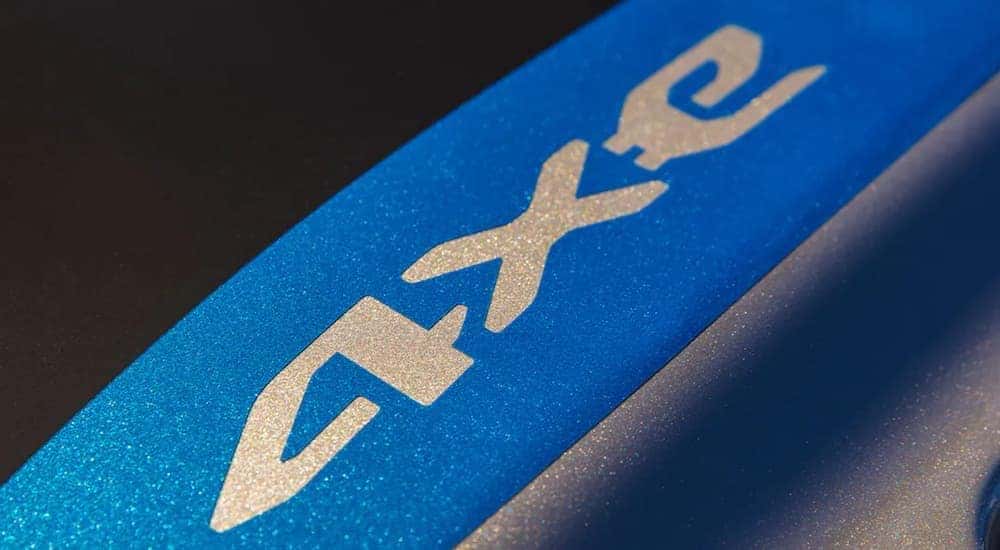 A close up shows the 2021 Jeep Wrangler 4xe logo.