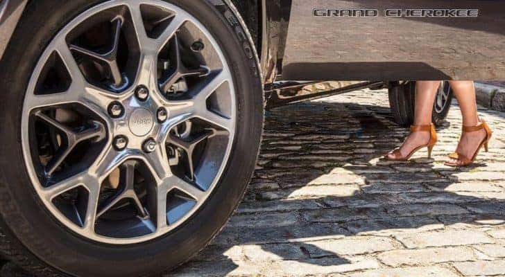 A close up shows the wheel and tire on a 2020 Jeep Grand Cherokee.
