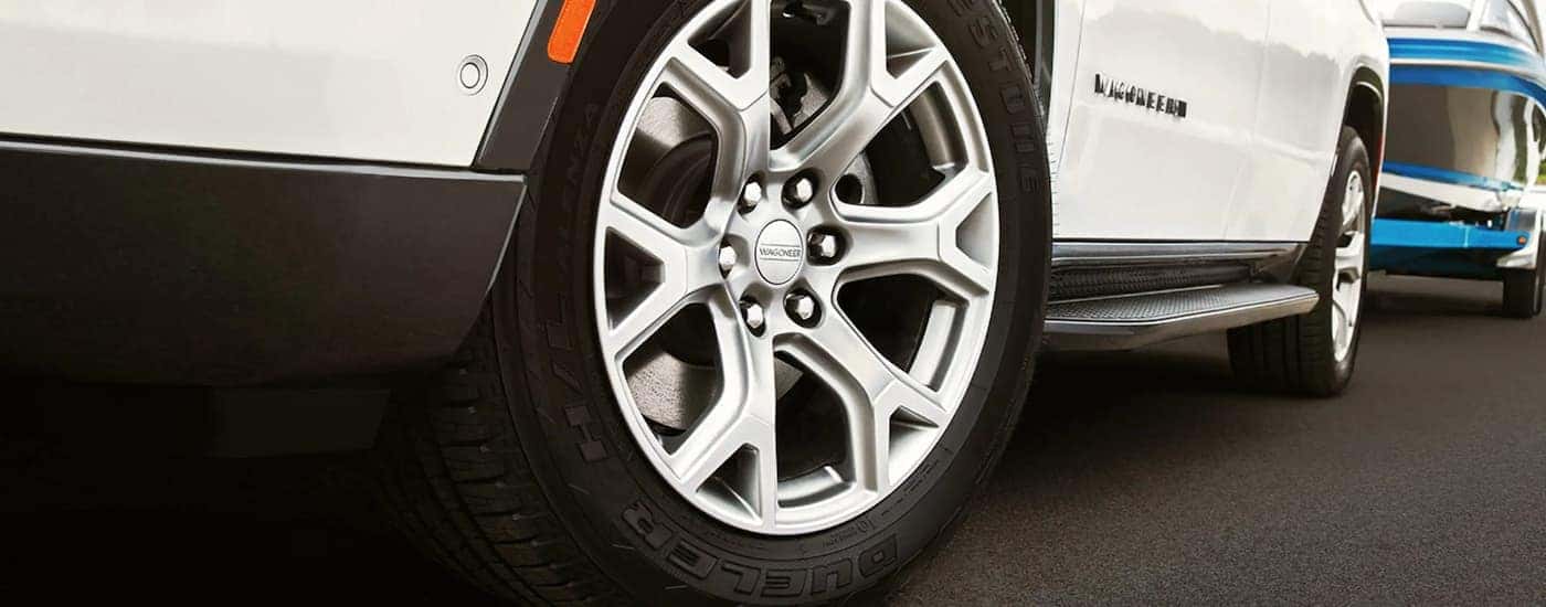 A close up of a white 2022 Wagoneer tire and rim is shown.