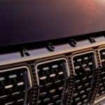 A close up of the grille on a black 2022 Wagoneer is shown.