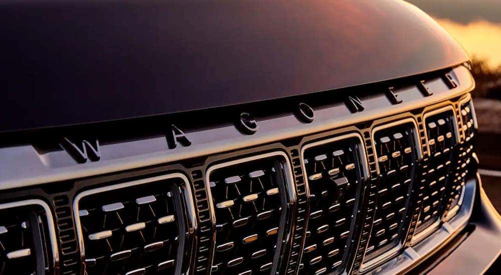 A close up of the grille on a black 2022 Wagoneer is shown.
