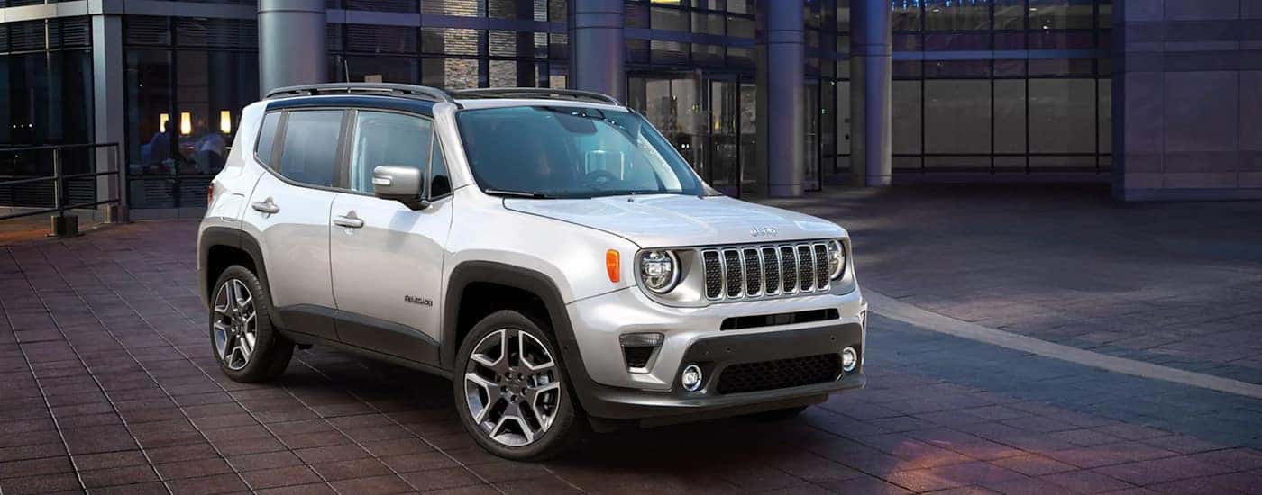 A silver 2022 Jeep Renegade is shown parked near a Fountain Jeep dealer.