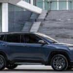 A blue 2022 Jeep Compass is shown from the side after leaving a Fountain Jeep dealer.