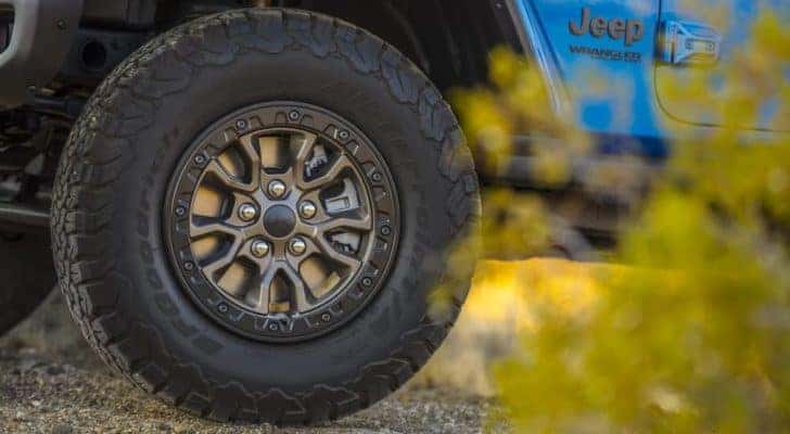 A close up shows the wheel and tire on a 2022 Jeep Wrangler Rubicon 392 Unlimited.