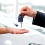 Keys are shown exchanging hands at a dealership after a customer asked a salesman to 'value my trade'.