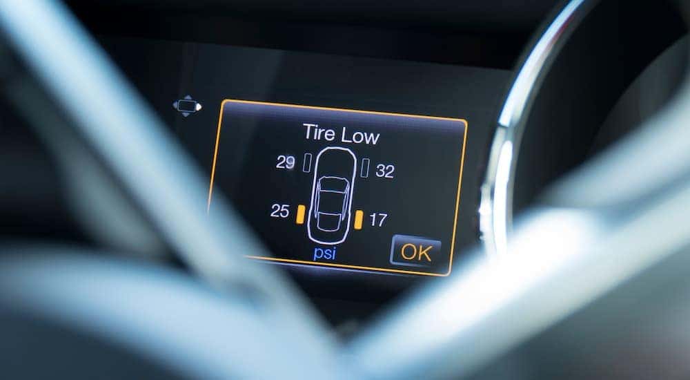 A close up of the tire pressure system on a car dashboard is shown.