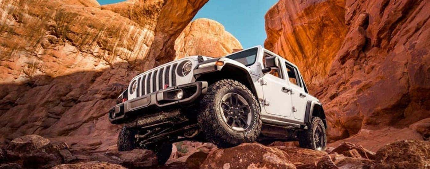 A white 2020 Jeep Wrangler Rubicon is shown from the front at an angle.
