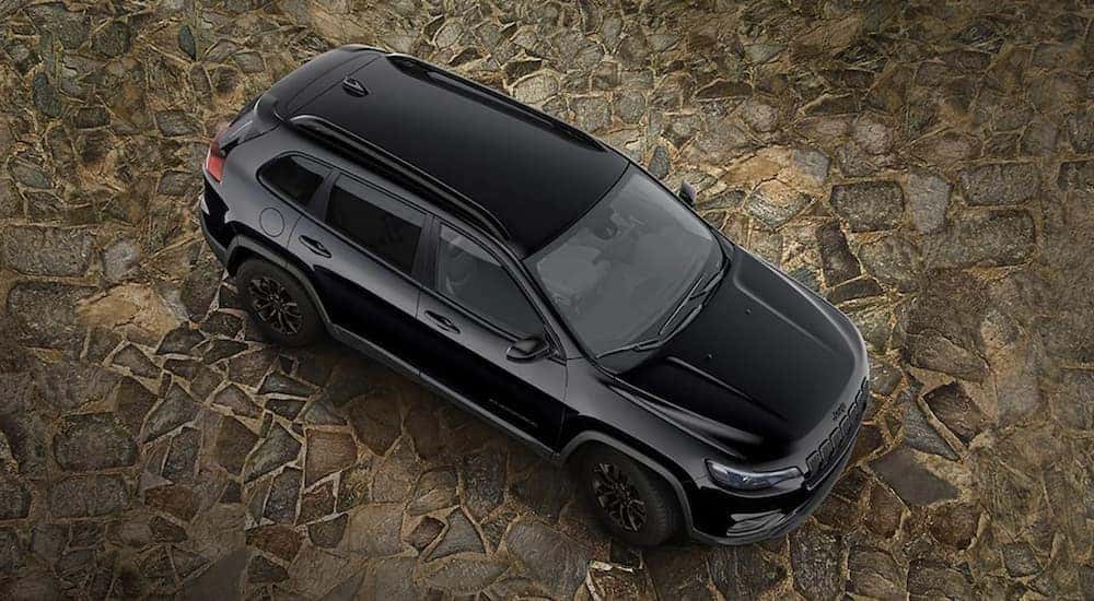 A popular Jeep Cherokee for sale, a black 2023 Jeep Cherokee, is shown from overhead.