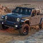 A grey 2021 Jeep Gladiator Mojave is shown from the front at an angle.