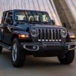 A grey 2022 Jeep Wrangler is shown from the front at an angle after getting a Jeep alignment.