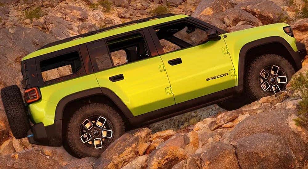 A lime 2022 Jeep Recon 4xe is shown from the side.