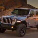 A silver 2021 Jeep Wrangler Rubicon 4xe is shown from the front at an angle.