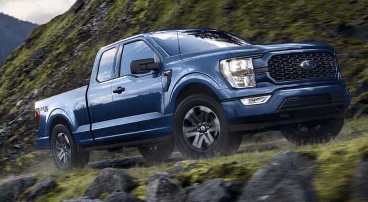 A blue 2022 Ford F-150 is shown from the front at an angle.