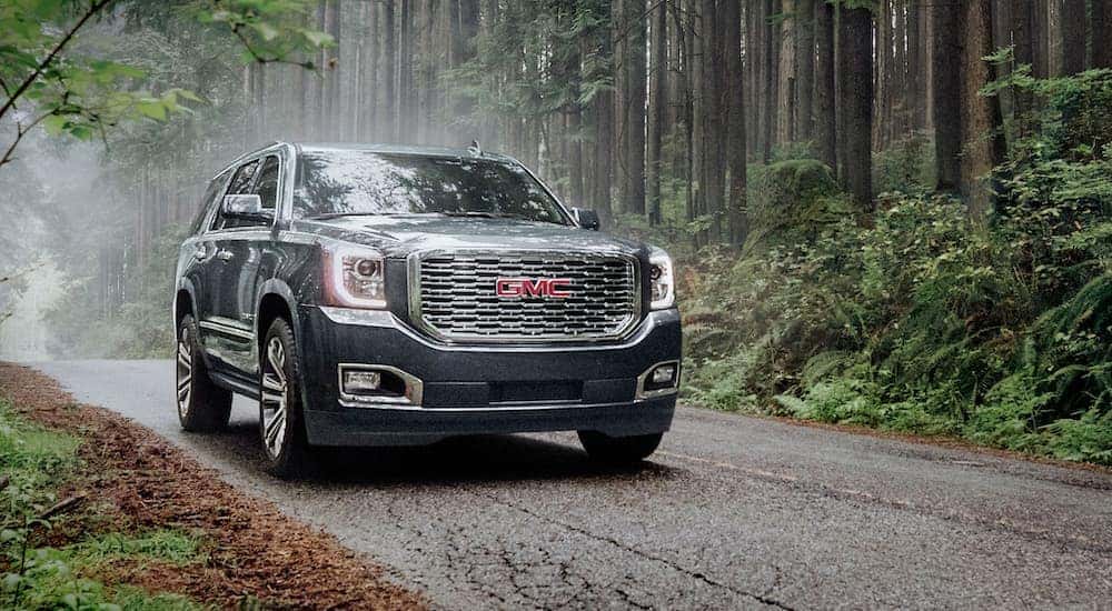A grey 2020 GMC Yukon is shown from the front at an angle after leaving a dealer that has used SUVs for sale in Colorado Springs, CO.