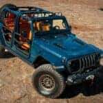 Jeep parts were shown to help build the blue 2023 Jeep Wrangler 4xe Rubicon Departure Concept.