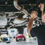 Two mechanics are shown performing a multipoint inspection.