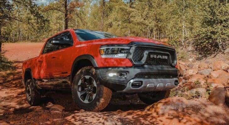 A red 2023 Ram 1500 Rebel is shown from the front at an angle.