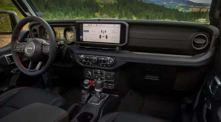The black dash is shown in a 2025 Jeep Gladiator for sale in Colorado Springs.