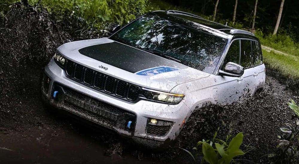 A 2025 Jeep Grand Cherokee 4xe Trailhawk is shown from the front at an angle.