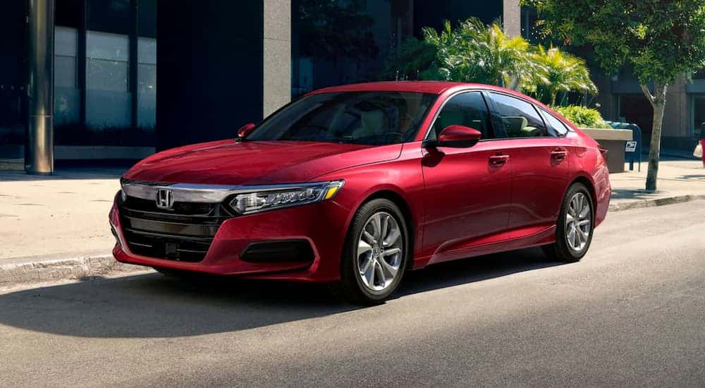 A red 2020 Honda Accord LX parked on a city street.