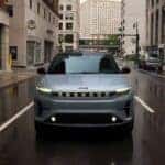 A silver 2025 Jeep Wagoneer S for sale in Colorado Springs driving in a city.